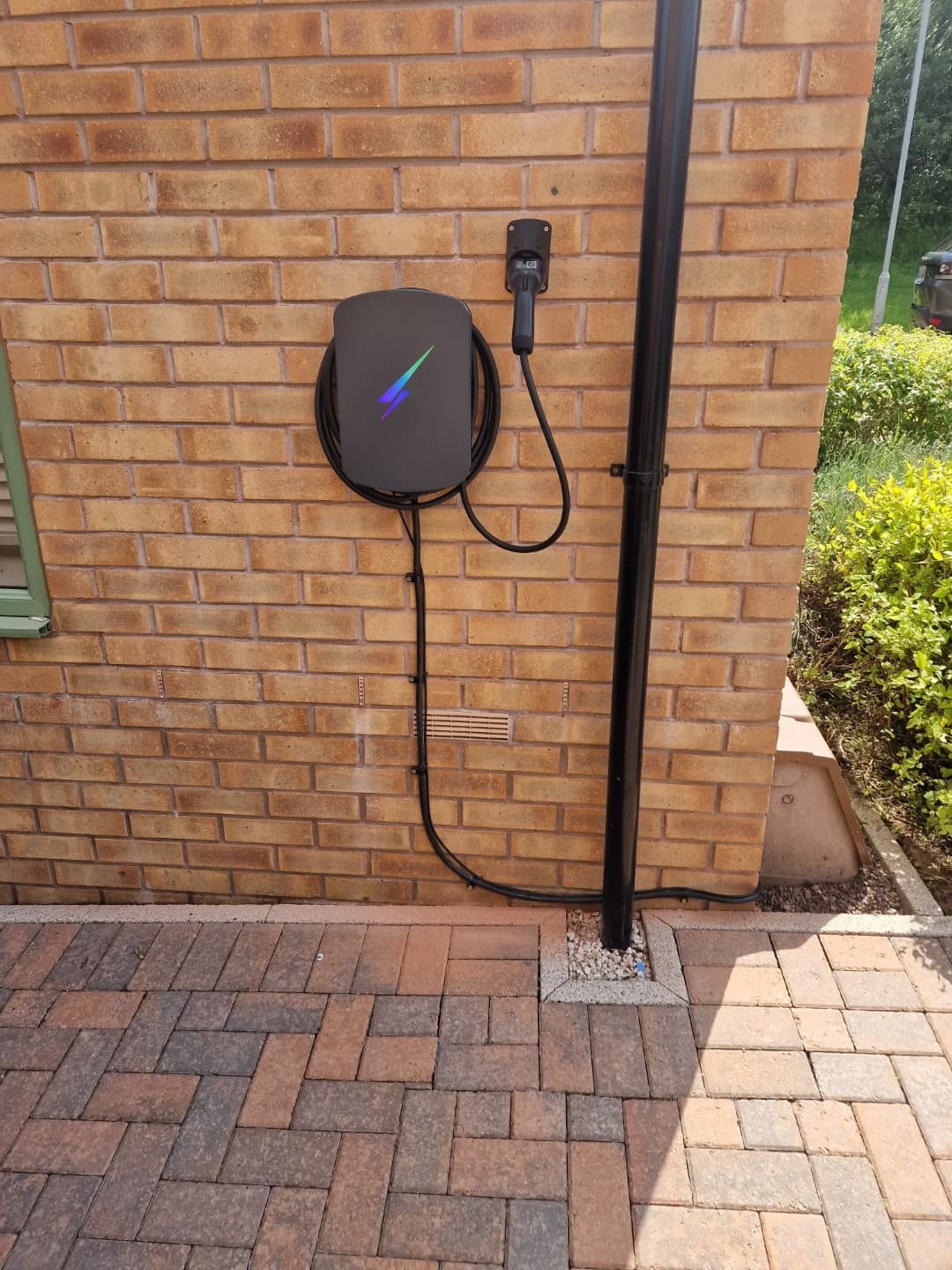 Hypervolt Home 3 Pro installed on exterior wall showing overall placement