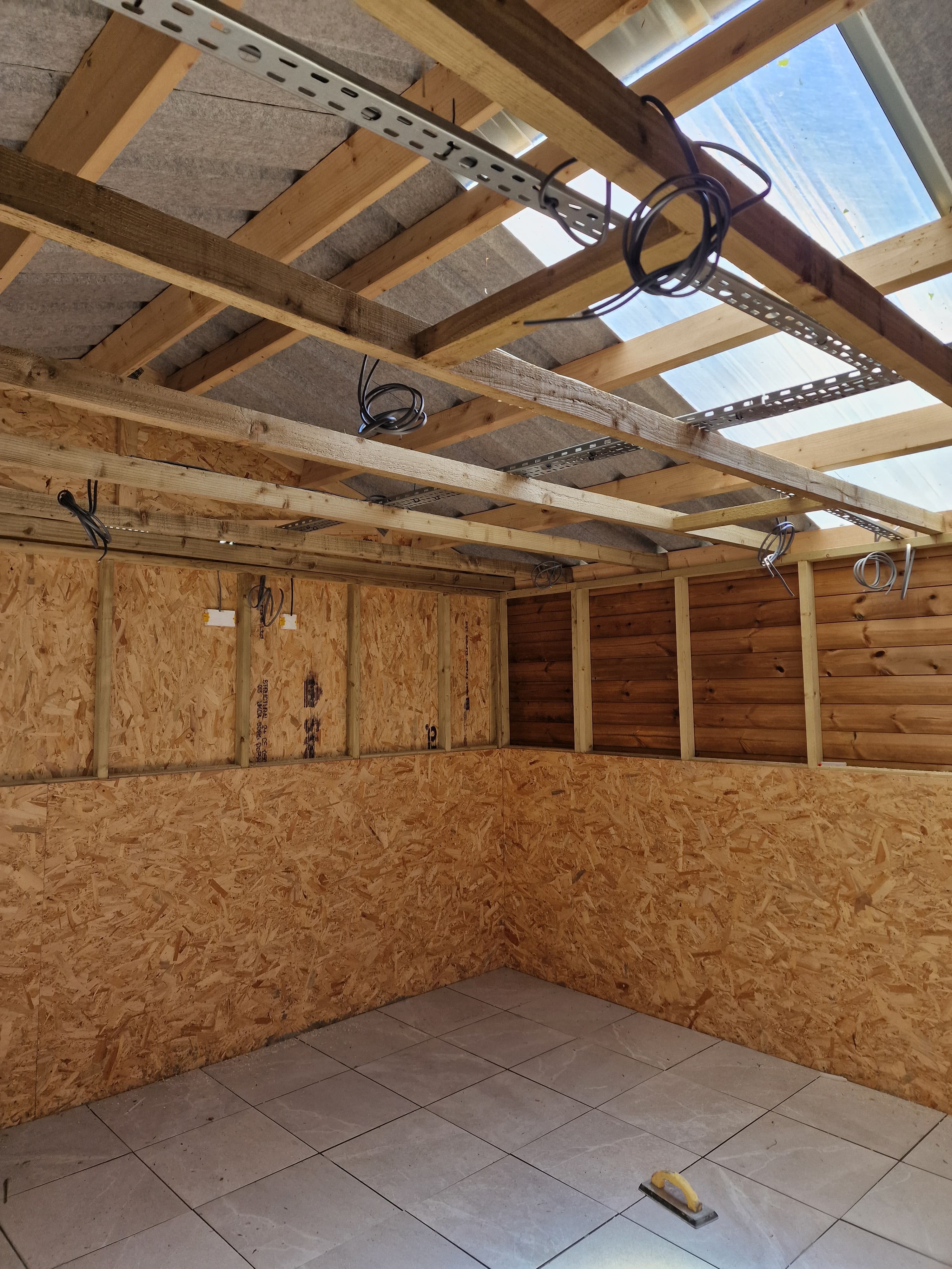 First-fix cabling installed within a tiled kennel room