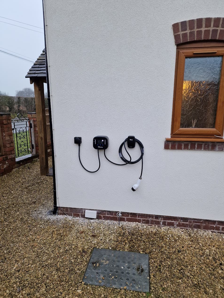 Ohme Home Pro installed on rendered wall with neat cable route