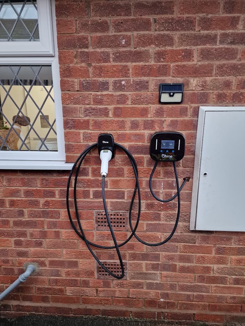 Ohme Home Pro installed beside local isolator with tidy routing